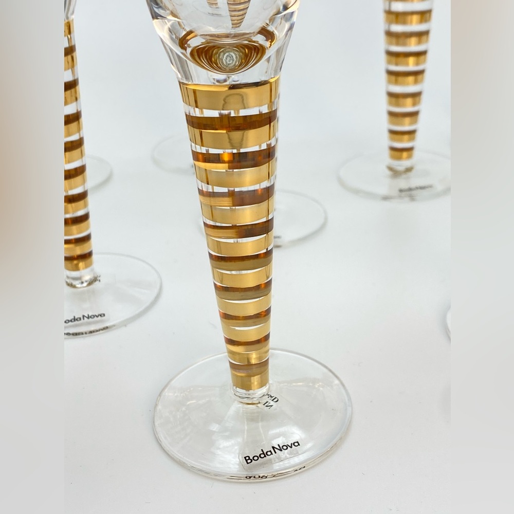 12 NIB gold champagne flutes, Liselotte Henriksen for Boda Nova.